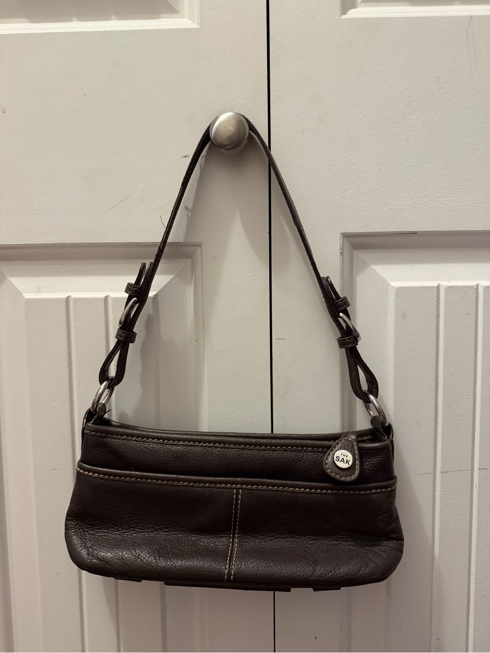 The Sak Dark Brown real Leather Shoulder Bag with Silver Charm